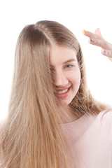 young girl looks at an electrified hair