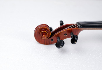 Naklejka na ściany i meble Scroll of violin put at the right side of background