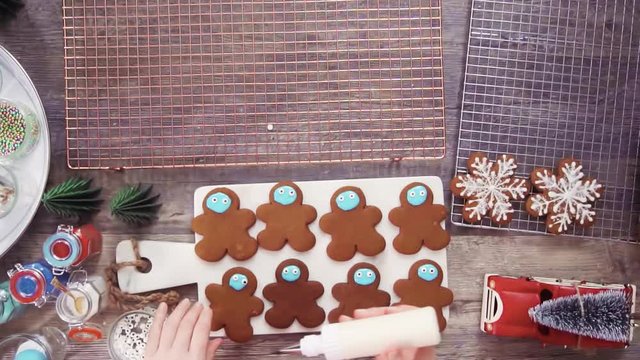 Step by step. Flat lay. Decorating gingerbread cookies with royal icing.