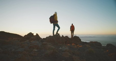 Happy couple exploring the outdoors together at sunset