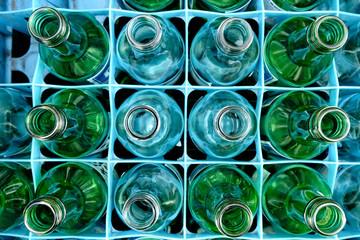 A shot of empy glass bottles ready to be recycled.