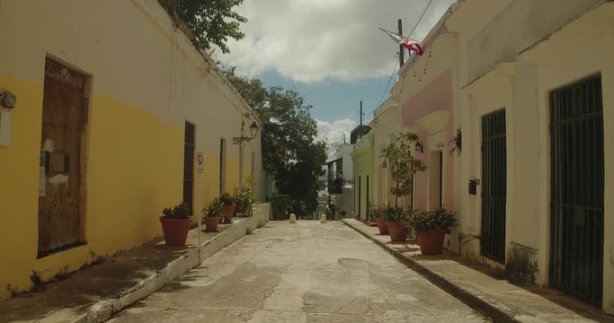Pastel colored building line a narrow street in Old San Juan Puerto Rico