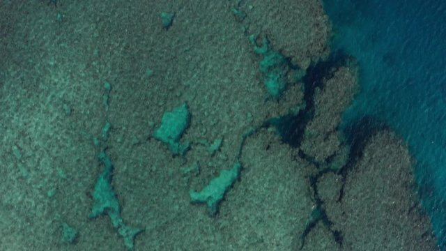 Beautiful coral reef waters shot from drone in Okinawa Japan aqua marine turquoise crystal clear water travel heaven tropical island