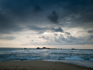 Landscape of dark rainy clouds over the ocean