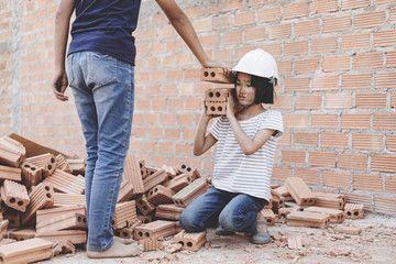 Children working at construction site for world day against child labor concept: