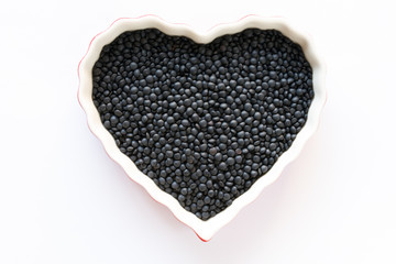 Uncooked Black Lentils in a Heart Shape