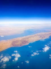 Beautiful image of flying in airplane over the islands in ocean