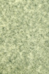 abstract splotchy grey green parchment paper background