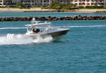 High-End motorboat powered with three outboard engines .