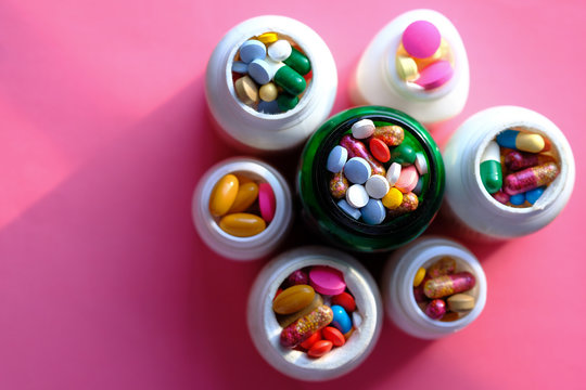 top view of pills and capsule in a contianer 