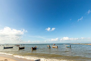 Fishing Boats in a Harbor and a Blue Sky. fishing boat on bay with blue sky background .