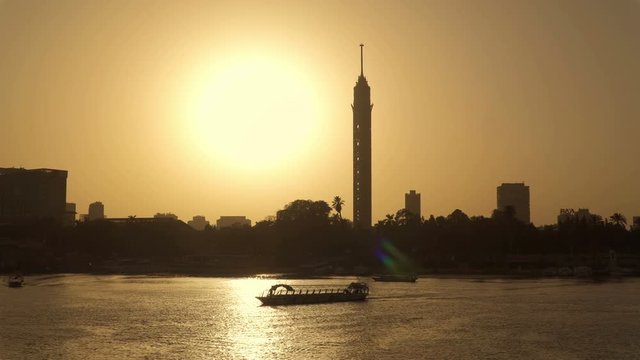 Silhouette sunset in Cairo, Egypt. The river Nile and Cairo tower. City skyline.