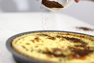 Sprinkle grated chocolate on top of tart. Making Lemon Mascarpone Pie Series.