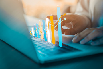 Business analytics and financial concept, Plans to increase business growth and an increase in the indicators of positive growth in 2020-2021 floating above digital laptop computer.