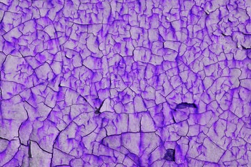 Closeup of paint cracks on a white wall, old wall.