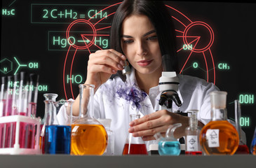 Female alchemist making elixir in laboratory