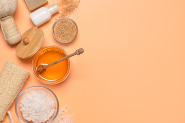 Composition with spa items and honey on color background