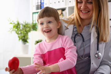 Cute little girl visiting family doctor office portrait
