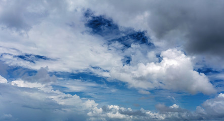 Fluffy Clouds In A Deep Blue Sky