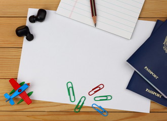 Travel concept.Top view accessories travel with passports, notepad, paper, pencil, earphones, toy...