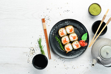 Sushi with crab and caviar cooked in oil. Sushi menu of Japanese restaurant. Top view. © Yaruniv-Studio