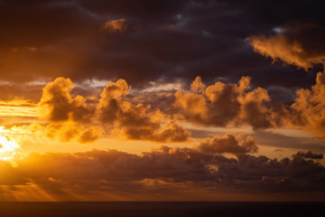 Fototapeta premium Sunset clouds over Tasman Sea from Waitakere Ranges in West Auckland 