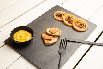 Pork tenderloin dish with pate and tomato and walnut salad