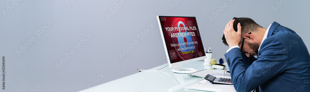Poster computer with ransomware word on the screen