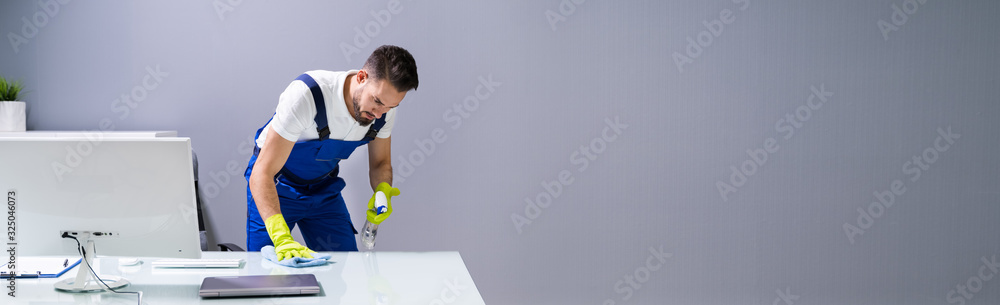 Wall mural Male Worker Cleaning Office