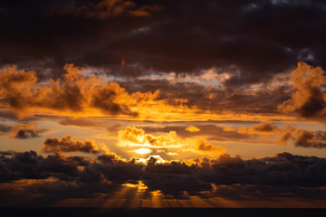 Sunset clouds over Tasman Sea from Waitakere Ranges in West Auckland 