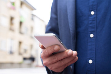 man with mobile phone in the city
