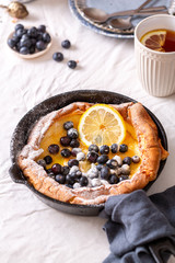 Fresh homemade dutch baby pancake with blueberries for breakfast or brunch