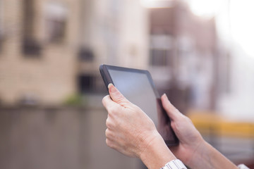 woman using a tablet or e-book