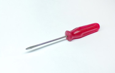 Isolated screwdriver on a white background. A small screwdriver for tightening screws and bolts.