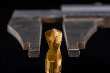Caliper measurement with drill diameter. Measuring accessories in the carpentry industry.