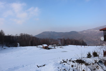 people enjoy outdoor activities in the mountains, skiing and snowboarding