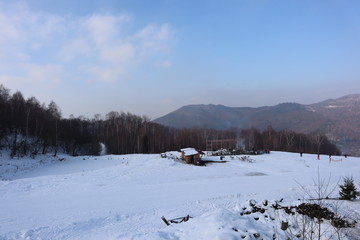 people enjoy outdoor activities in the mountains, skiing and snowboarding