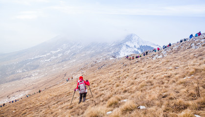 Fototapeta na wymiar Winter Mountain Landscape People Trekking