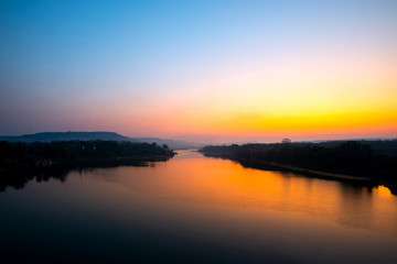 Reflection of vivid sunset sky reflection in  water.