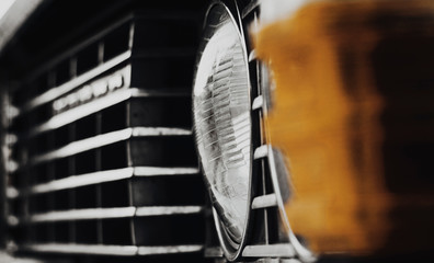 Close-Up Classic Vintage Car Front Grill and Headlight detail. Photo of Retro Car Headlight. USSR...
