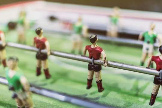 table football in closed frame indoors.