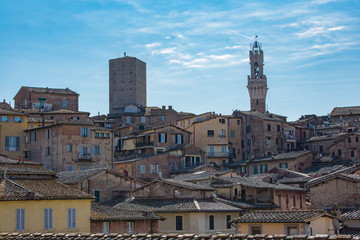 Fototapeta na wymiar Beautiful panoramic view of the historic city of Siena at summer day with blue sky Tuscany, Italy
