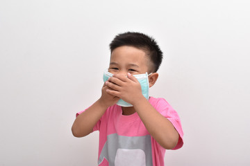 Asian little boy wearing the mask on white background.