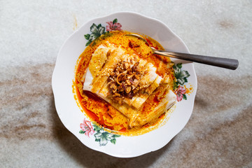 Serving of curry chee cheong fun, popular breakfast in Malaysia among Chinese.