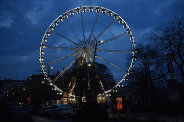 Colorful illuminated ferris wheel at night