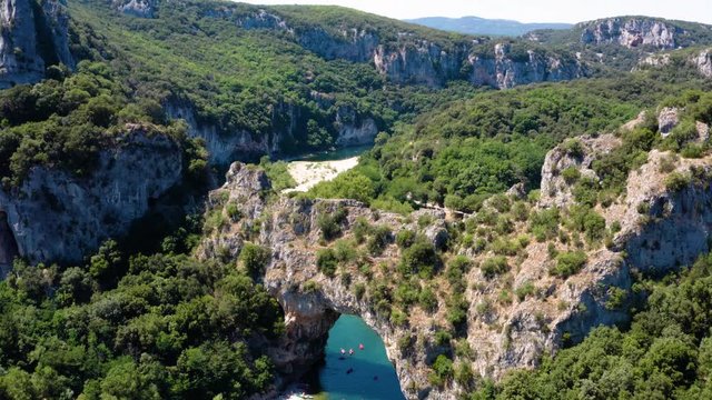 Ungraded Aerial view of Narural arch in Vallon Pont D'arc in Ardeche canyon in France