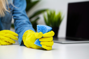 Close Up cleaning company worker hand holding sponge