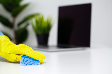 Close Up cleaning company worker hand holding sponge