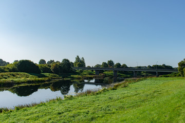 Fototapeta premium Landscape of lake and green islands and forest background.