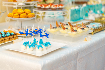 table setting with flowers and sweets